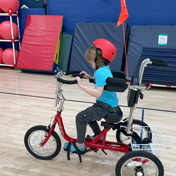 A child on a bike.
